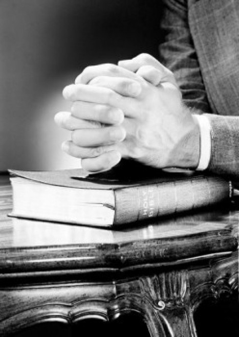 Folded hands on top of Bible Poster Print - Item # VARSAL255422496