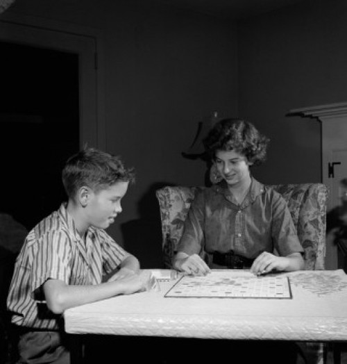 Mother playing scrabble with son in home Poster Print - Item # VARSAL255417577