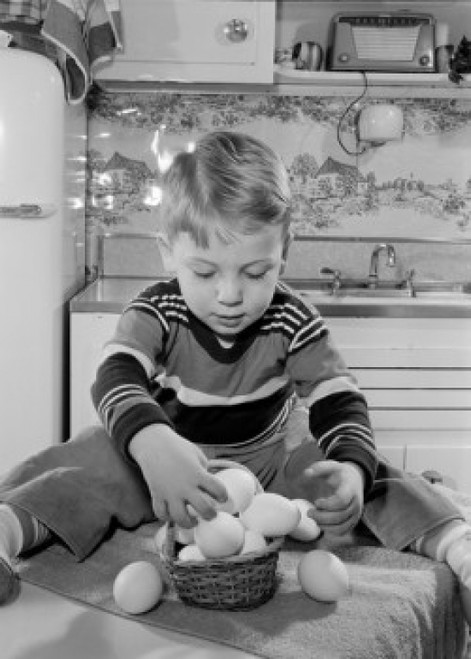 Boy putting eggs into basket Poster Print - Item # VARSAL255417007