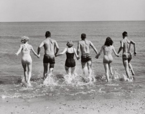Rear view of three young couples running on the beach Poster Print - Item # VARSAL25518675