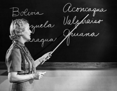 Side profile of a female teacher teaching in the classroom Poster Print