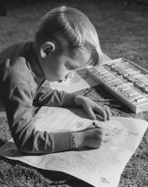 Side profile of a boy drawing with crayons Poster Print - Item # VARSAL25513168