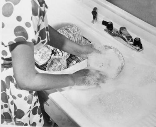 Mid section view of a young woman washing dishes Poster Print - Item # VARSAL25541971