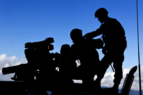 Silhouette of soldiers operating a BGM-71 TOW guided missile system Poster Print - Item # VARPSTSTK104073M Silhouette of soldiers operating a BGM-71 TOW guided missile system Poster Print - Item # VARPSTSTK104073M