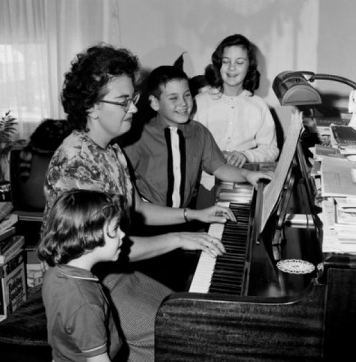 Mother playing piano and children singing Poster Print - Item # VARSAL255421629