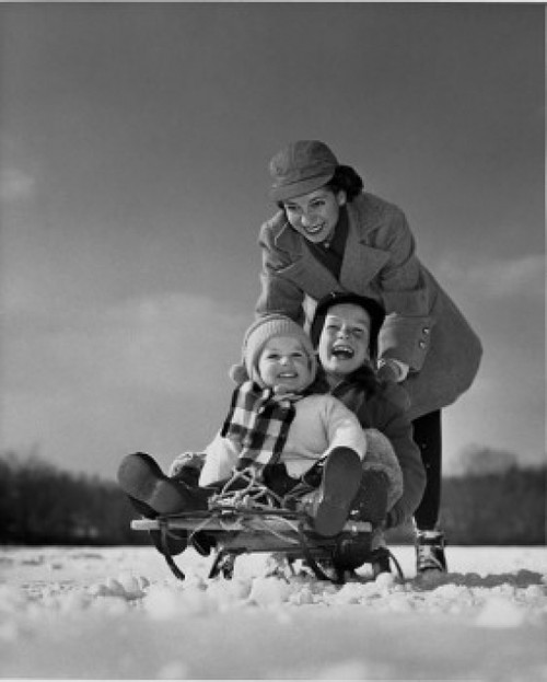 Mother pushing her children on a sled Poster Print - Item # VARSAL2554031