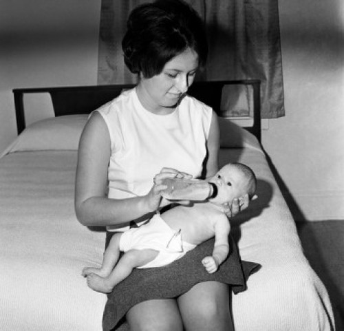 Mother feeding baby with bottle Poster Print - Item # VARSAL2559839