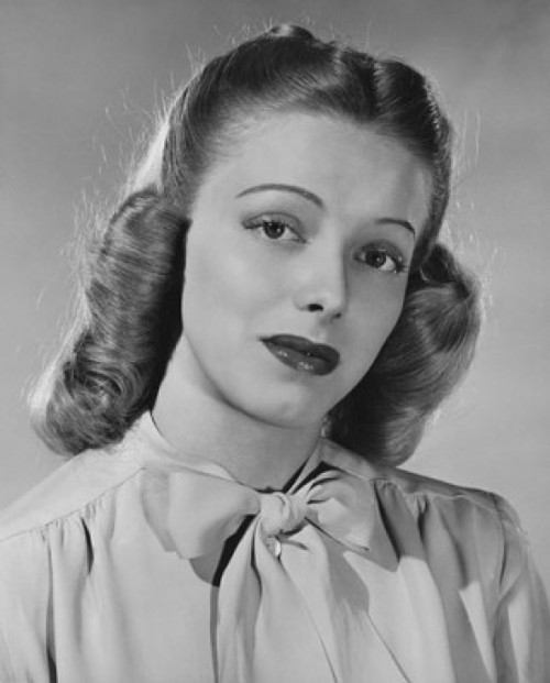 Studio portrait of young woman looking serious Poster Print - Item # VARSAL25510725 Studio portrait of young woman looking serious Poster Print - Item # VARSAL25510725