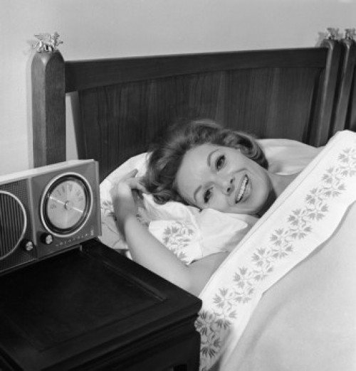 Young woman lying in bed smiling Poster Print - Item # VARSAL255420833