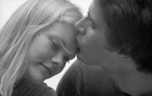 Close-up of a young man kissing a young woman's forehead Poster Print - Item # VARSAL25541464