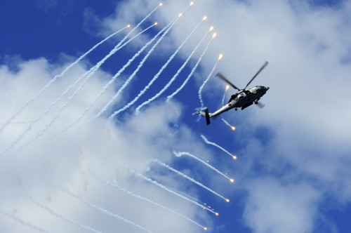 An HH-60H Sea Hawk helicopter releases countermeasure flares Poster Print - Item # VARPSTSTK104838M