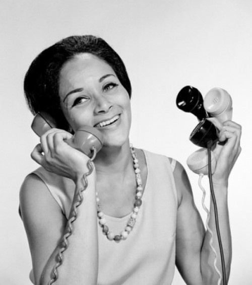 Happy African-American woman holding receivers Poster Print - Item # VARSAL255417790