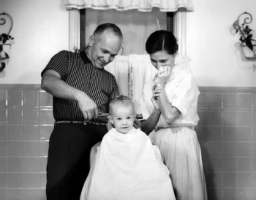 Father cutting son's hair while mother watching Poster Print - Item # VARSAL2559763