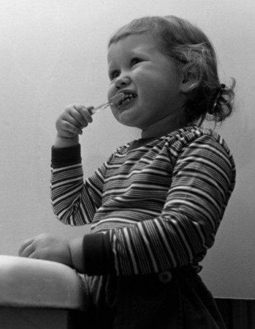 Small girl brushing teethes Poster Print - Item # VARSAL2558971