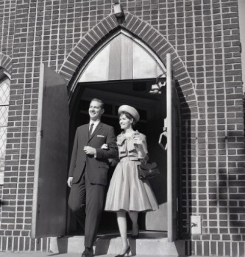 Mid adult couple leaving church Poster Print - Item # VARSAL255420831