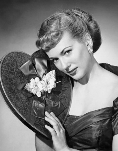 Portrait of a young woman holding a Valentine gift Poster Print - Item # VARSAL25523082B