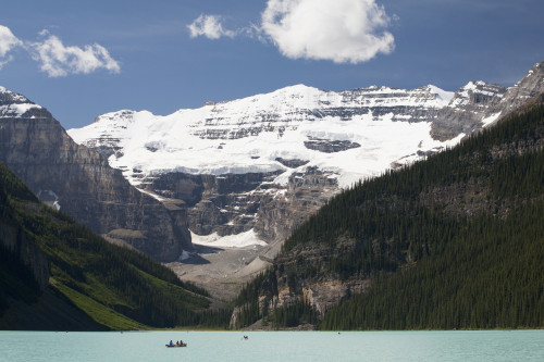 Mount Victoria And Lake Louise With Canoes In The Distance And Blue Sky With Clouds; Lake Louise Alberta Canada PosterPrint - Item # VARDPI2075521