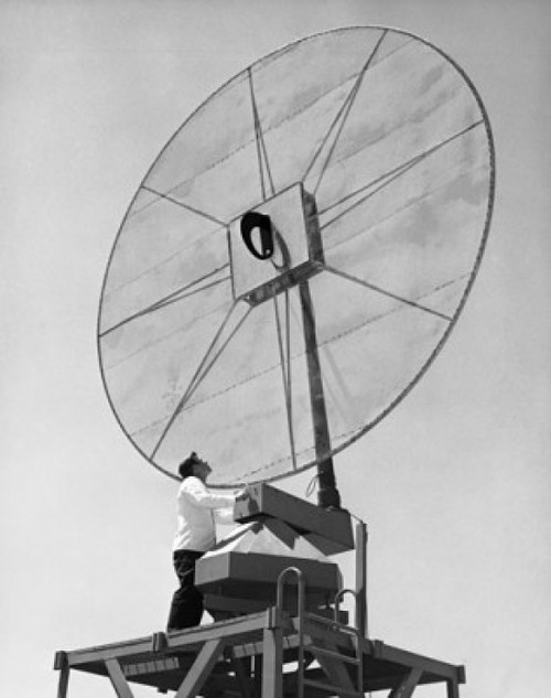 Low angle view of an engineer standing in front of a Scimitar antenna Poster Print - Item # VARSAL25535525