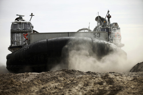 A landing craft, air cushion prepares to depart Onslow Beach Poster Print - Item # VARPSTSTK105220M