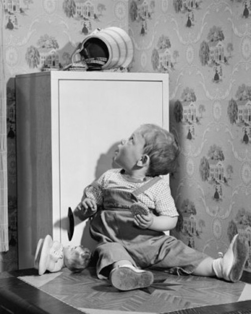Baby boy sitting and looking at a fallen jar of cookies Poster Print - Item # VARSAL2559664A