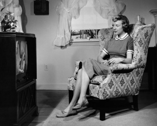 Mid adult woman watching television Poster Print - Item # VARSAL25511272