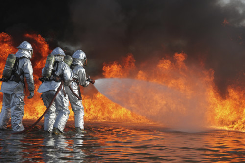 December 7, 2011 - Aircraft Rescue and Firefighting Marines battle a huge blaze during a pit fuel fires training exercise at the burn pit Poster Print - Item # VARPSTSTK105241M