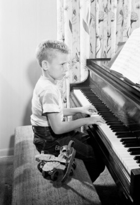Side profile of boy playing piano Poster Print - Item # VARSAL25513164