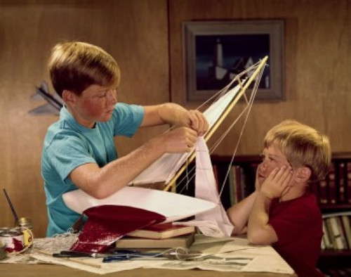 Two boys assembling a model of sailboat Poster Print - Item # VARSAL3811361334C Two boys assembling a model of sailboat Poster Print - Item # VARSAL3811361334C