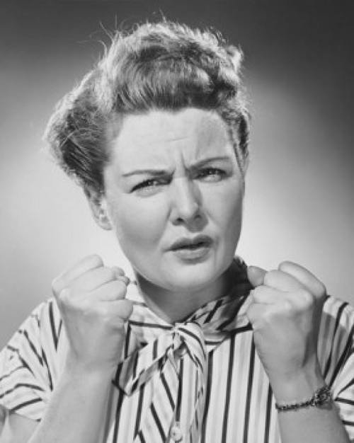 Portrait of a mature woman clenching her fists in anger Poster Print - Item # VARSAL25511531