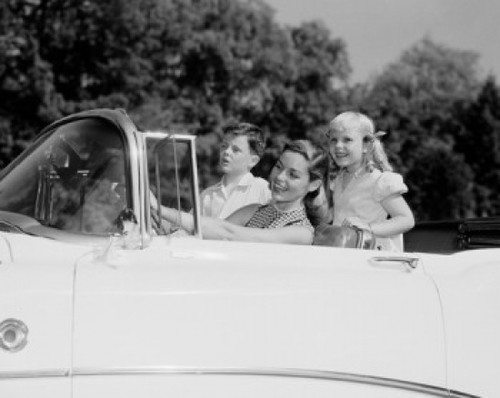 Happy mother with two children in convertible car Poster Print - Item # VARSAL255424629