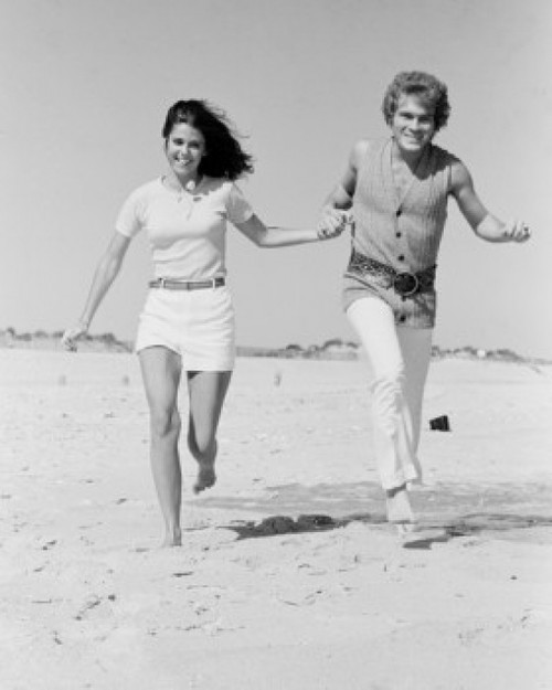 Young couple running on beach Poster Print - Item # VARSAL255422432