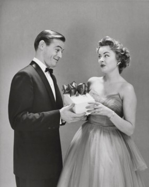 Young man giving a gift to a young woman Poster Print - Item # VARSAL2552960B
