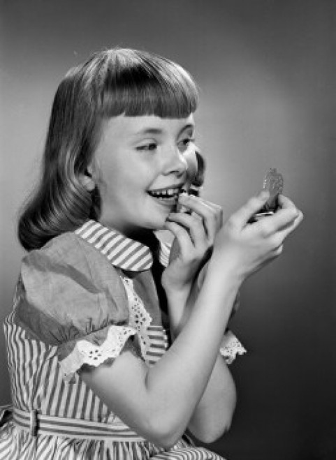 Girl putting lipstick on Poster Print - Item # VARSAL255417922