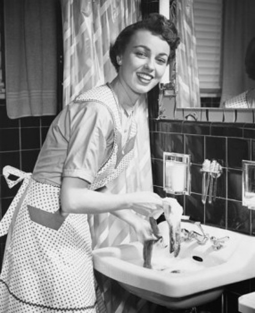 Portrait of a young woman hand washing clothes in the bathroom sink. Poster Print - Item # VARSAL25541730