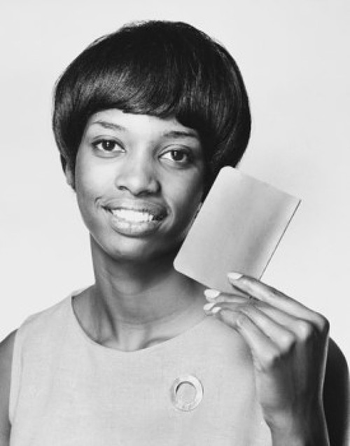 Portrait of a young woman showing a bank book Poster Print - Item # VARSAL25520840