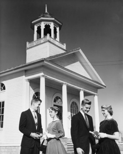 Two young couples standing in front of a church Poster Print - Item # VARSAL25543083