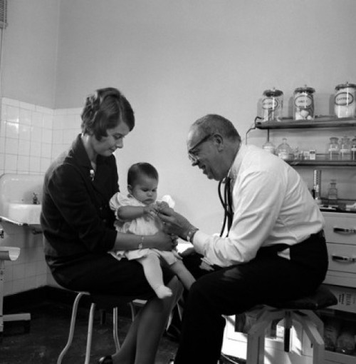 Mother with baby girl in doctor's office Poster Print - Item # VARSAL255416512