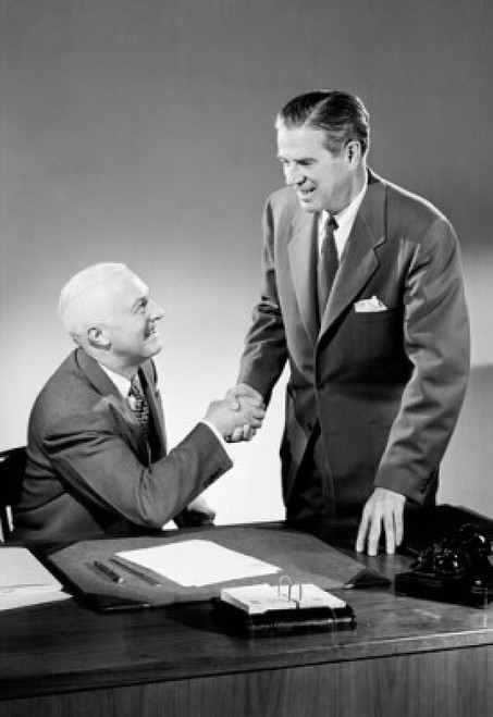Two businessmen shaking hands in an office Poster Print - Item # VARSAL2559255