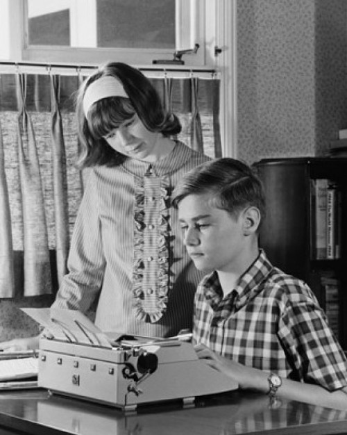 Teenage boy typing on a typewriter and his sister standing beside him Poster Print - Item # VARSAL25516400B Teenage boy typing on a typewriter and his sister standing beside him Poster Print - Item # VARSAL25516400B