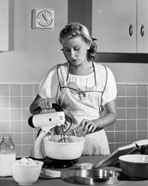 Young woman using an egg beater in a domestic kitchen Poster Print - Item # VARSAL2554585B