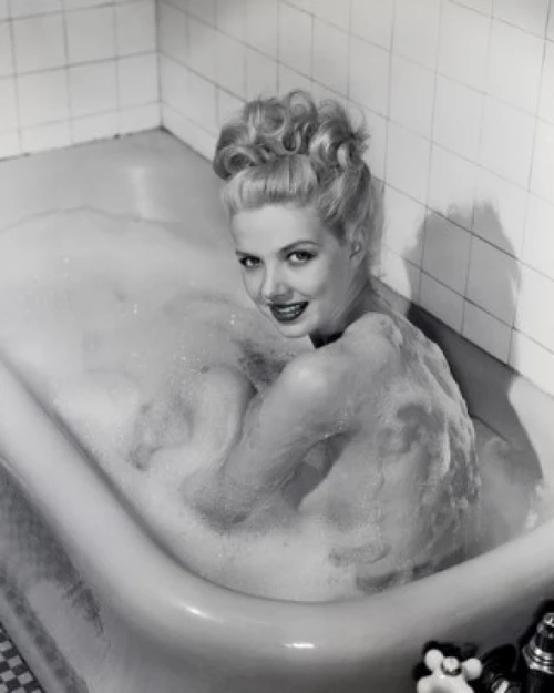 Young woman taking bath Poster Print