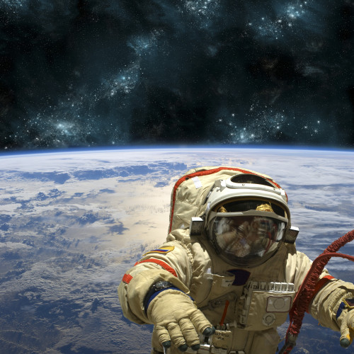 A cosmonaut floats in space above Earth. Stars shine in the background. Poster Print - Item # VARPSTMRC200122S