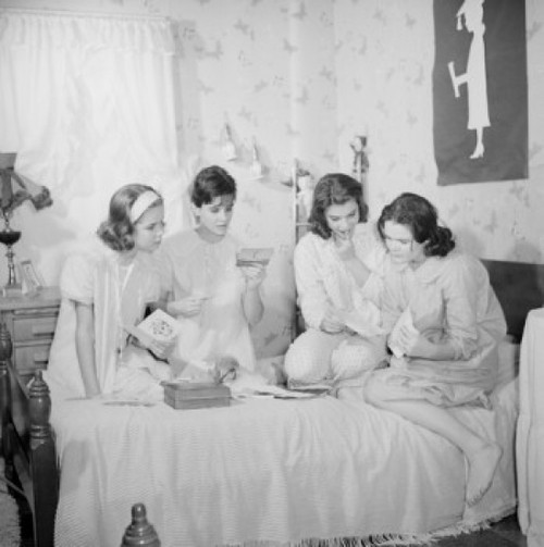 Four girls sitting on bed and reading letters Poster Print - Item # VARSAL255422678