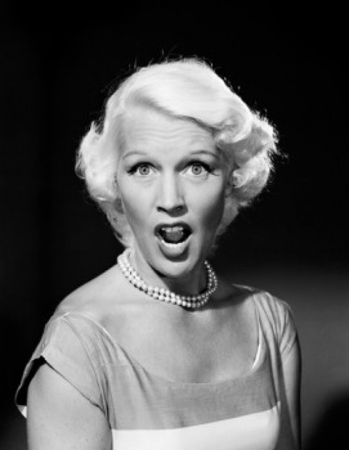 Portrait of mid adult woman with mouth open and raised eyebrows Poster Print - Item # VARSAL255417968