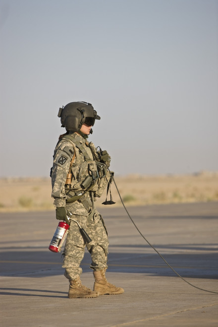 A UH-60 Black Hawk flight crew member stands by with a fire extinguisher, Tikrit, Iraq Poster Print - Item # VARPSTTMO100777M