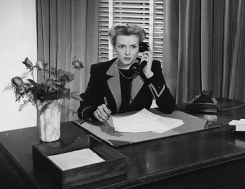 Businesswoman talking on the telephone in an office Poster Print - Item # VARSAL2556557