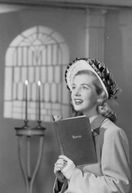 Female choir singer holding book in church Poster Print - Item # VARSAL255422975