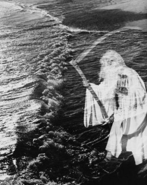 Senior man holding scythe and hourglass on the beach Poster Print - Item # VARSAL25539973