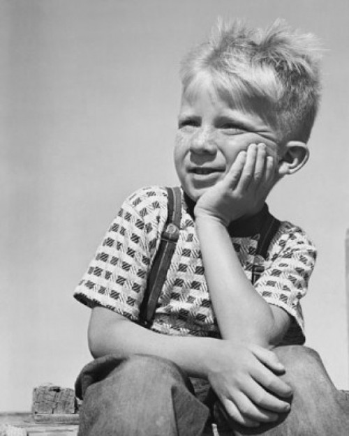 Boy sitting with hand on chin Poster Print - Item # VARSAL25512738