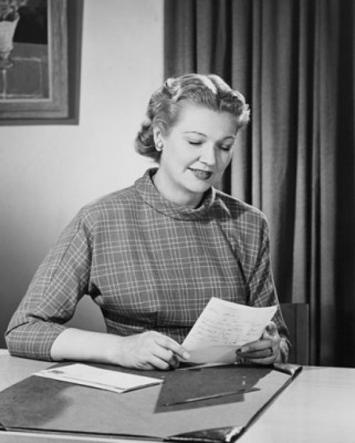 Mid adult woman reading a letter Poster Print - Item # VARSAL25542016